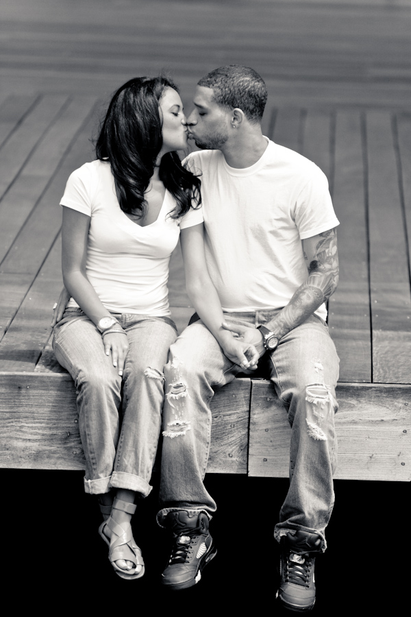Black and white photo - Engagement photo session with couple wearing matching white t-shirts and jeans - photo by North Carolina based wedding photographer Jeremie Barlow